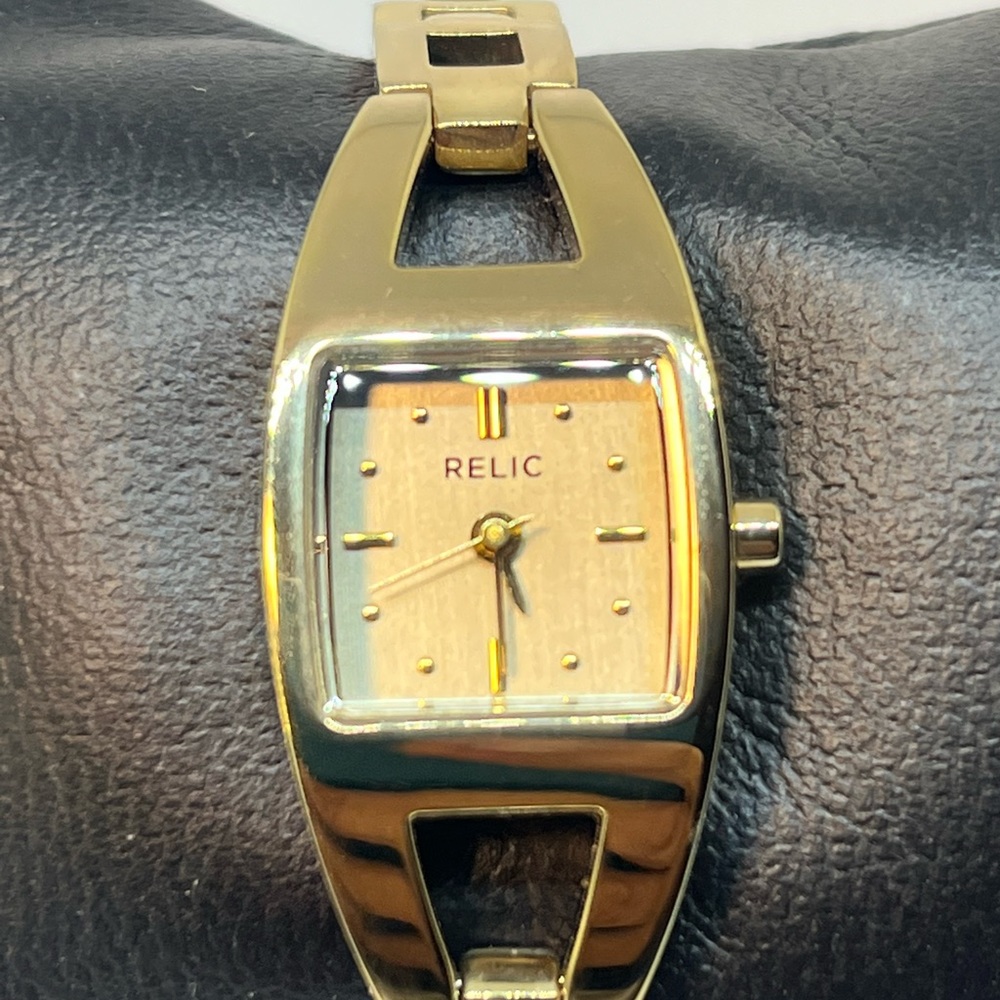 RELIC! very classy, elegant watch! I’ll go tone with a gold dial. Size 5 1/2
